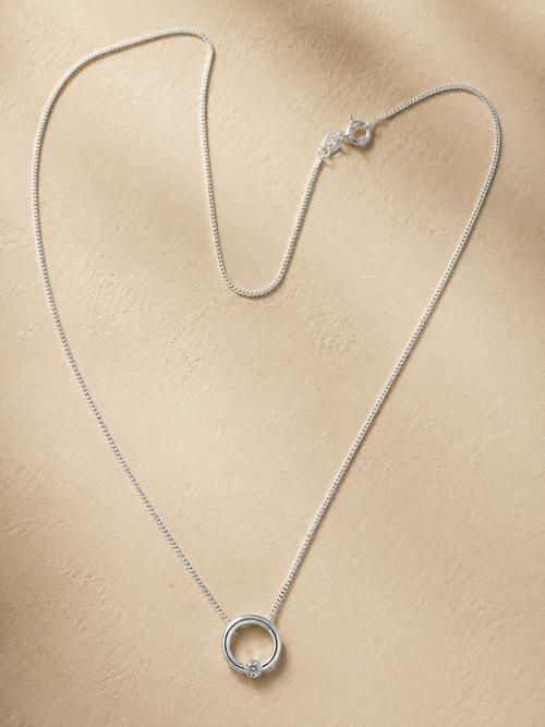 Circle of life with a shining light sterling silver pendant with CZ