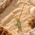 Long stainless steel pendant with enamel fish, real pearl & larimar