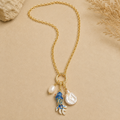 Long stainless steel pendant with enamel fish and real pearls