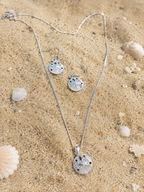 Dainty pendant in sterling silver inspired by cowry shells