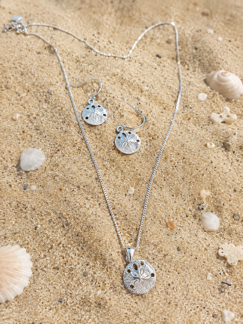 Dainty pendant in sterling silver inspired by cowry shells